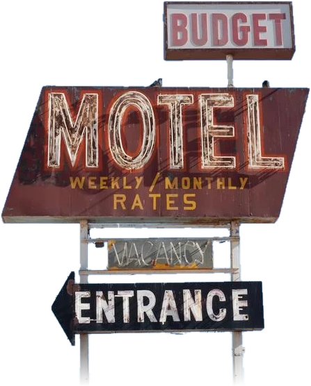 A weathered roadside budget motel sign